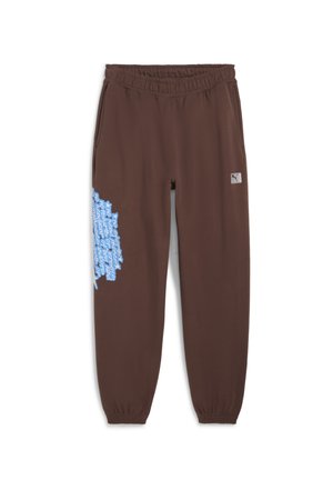 Brown jogger pants with an elastic waistband, featuring blue graphic text on the left leg and a small logo patch on the right hip.