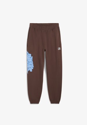 Bruna joggingsbyxor med elastisk midja, prydda med blå grafisk text på vänster ben och en liten logotyp på höger höft.