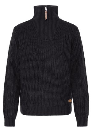 Black knitted sweater with long sleeves, ribbed high collar, half zipper with brown pull tab, and small brown logo patch near hem.