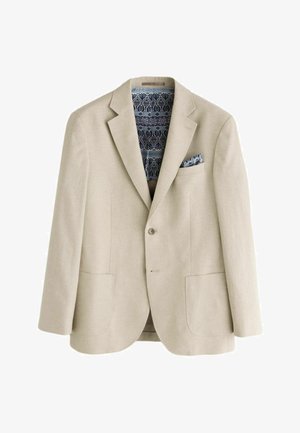 Beige blazer med to forlommer, enkelt knap, mønstret blå og sort for, og matchende mønstret lommetørklæde.