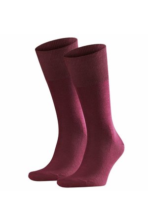 Pair of plain, mid-calf length burgundy socks with ribbed cuffs, displayed side by side on a white background.