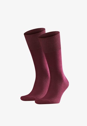 Pair of plain, mid-calf length burgundy socks with ribbed cuffs, displayed side by side on a white background.
