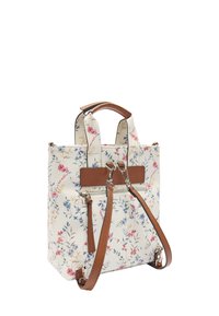 Torebka w kwiatowy wzór na kremowym tle, z brązowymi skórzanymi elementami, dwoma górnymi uchwytami oraz odpinanym paskiem. Posiada zamykaną na zamek komorę.