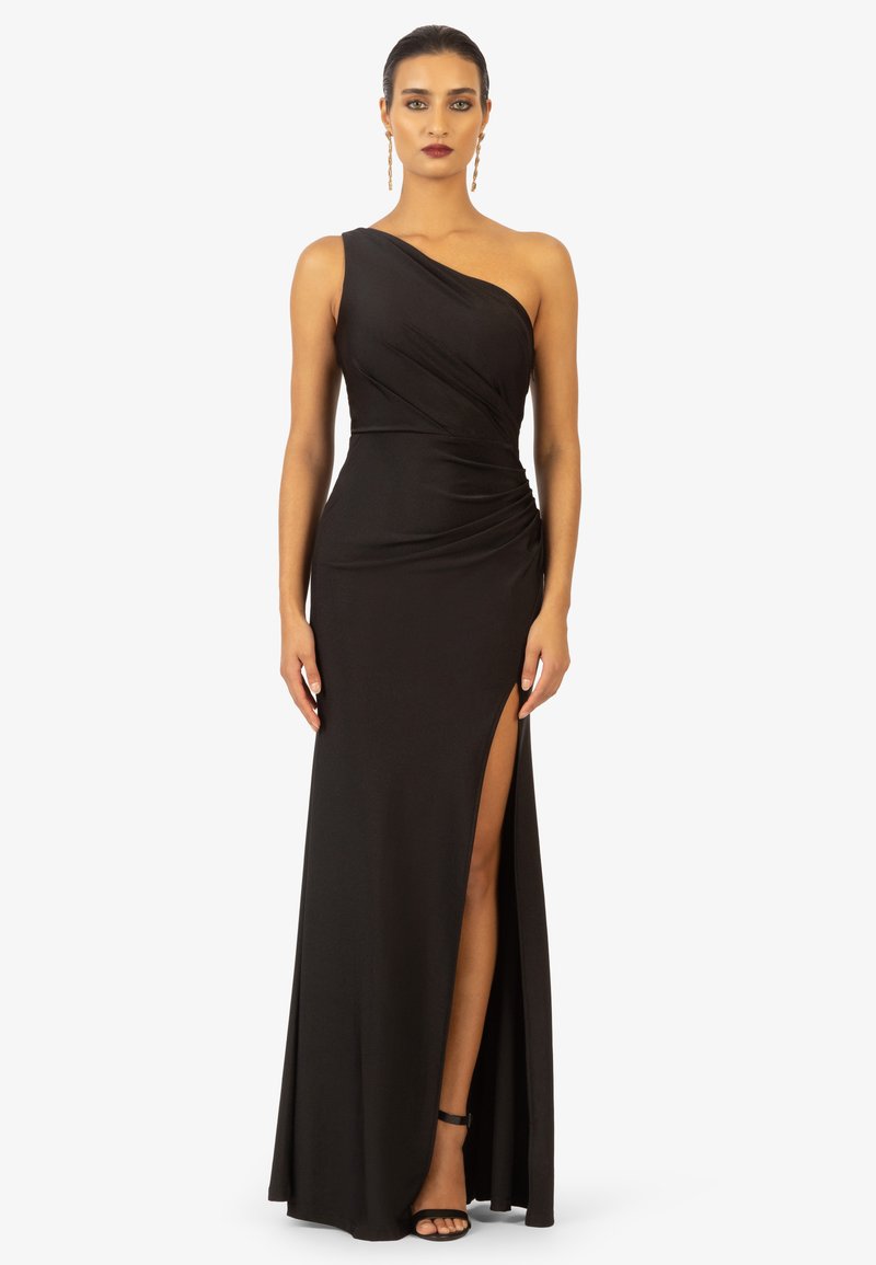 Schwarzes One-Shoulder-Kleid mit Raffung, hohem Schlitz an der Seite und bodenlanger Säume. Weicher, glatter Stoff mit subtiler Dämpfung und minimalistischer Gestaltung.