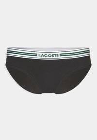 Fekete bikini alsó kontrasztos zöld és fehér csíkozott derékkal, rajta a "LACOSTE" logóval. Sima anyag, körkörös szabás.