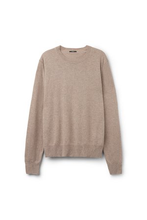 Pull en maille beige, col rond, manches longues, bords et ourlet côtelés, texture douce, design minimal, sans motifs ni logos visibles.