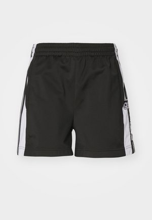 Svarta sportshorts med elastisk midja, vita sidostråk och en logodetalj på vänster ben. Slät tyg, knälång design.
