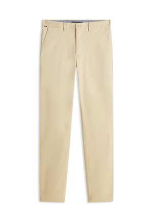 Beiget puuvillaiset housut suoralla lahkeella, joissa on sivutaskut, napillinen suljenta ja hienovaraiset yksityiskohdat vyötäröllä.