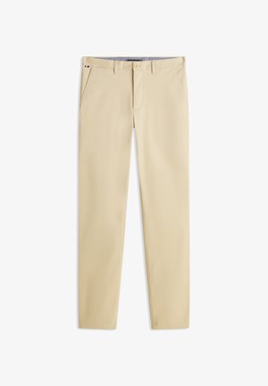 Beiget puuvillaiset housut suoralla lahkeella, joissa on sivutaskut, napillinen suljenta ja hienovaraiset yksityiskohdat vyötäröllä.