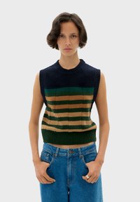 Sleeveless, striped knit sweater in navy, green, and beige. Ribbed neckline and hem, featuring a textured pattern with contrasting colors.