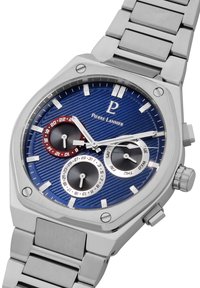 Sølvfarvet rustfrit st�ål ur med en blå tekstureret urskive, tre lille skiver og et metallisk armbånd. Har et logo og et sporty design.