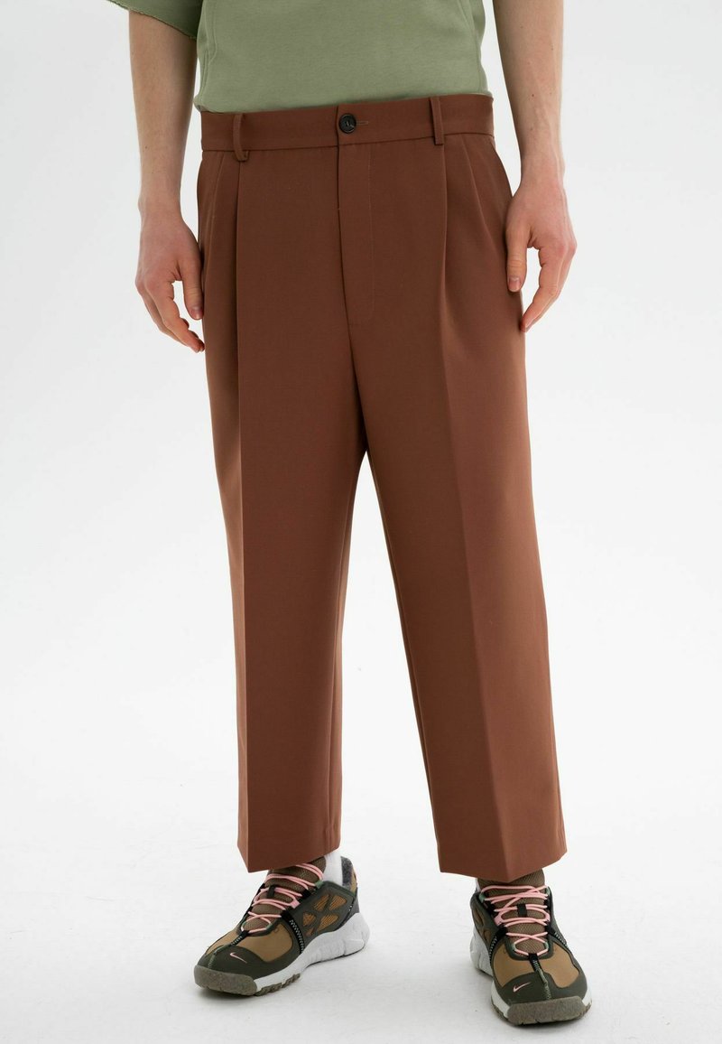 ET NOS UNISEX Trousers chocolate/dark brown Zalando.ie