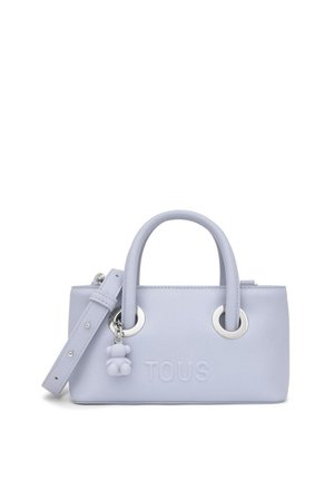 Borsa a mano in pelle color viola chiaro con doppi manici, tracolla removibile, logo "TOUS" in rilievo e piccolo ciondolo a forma di orsetto.