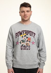 Šedá mikina s logem a postavami "Powerpuff Girls", se vstřícnými růžovými hvězdami, žebrovanými manžetami a kulatým výstřihem.