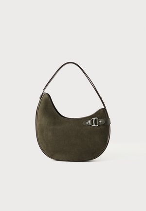 Dark olive green suede crescent-shaped handbag with a single strap and silver buckle detail on a plain white background.