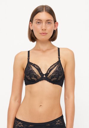 Black lace bralette with triangle cups, supportive underbands, and adjustable straps. Features intricate lace patterns and a sheer design.