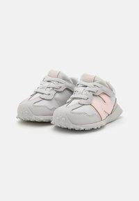 Gray sneakers featuring a smooth upper, pink accents, round toe, textured white sole with grip, and standard lace-up design.