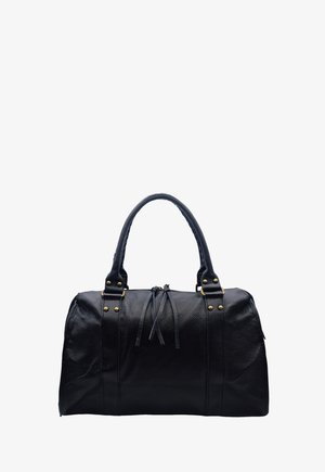 Sac de voyage en cuir noir avec deux poignées, ferrures dorées, et une fermeture éclair avec des tirettes en cuir.