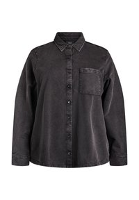 Schwarzes Denimhemd mit langen Ärmeln, durchgehender Knopfleiste, spitzem Kragen, einer Brusttasche und weicher Textur. Leicht entspannte Passform.