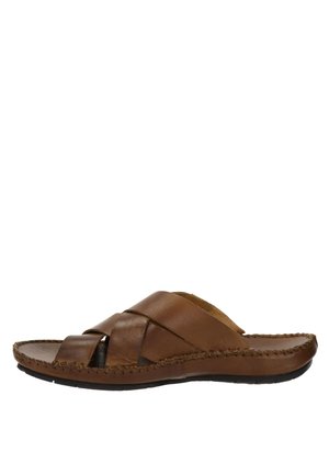 Brown leather slide sandal with crisscrossed straps, flat sole, and woven stitching along the edge. Smooth texture with a natural finish.