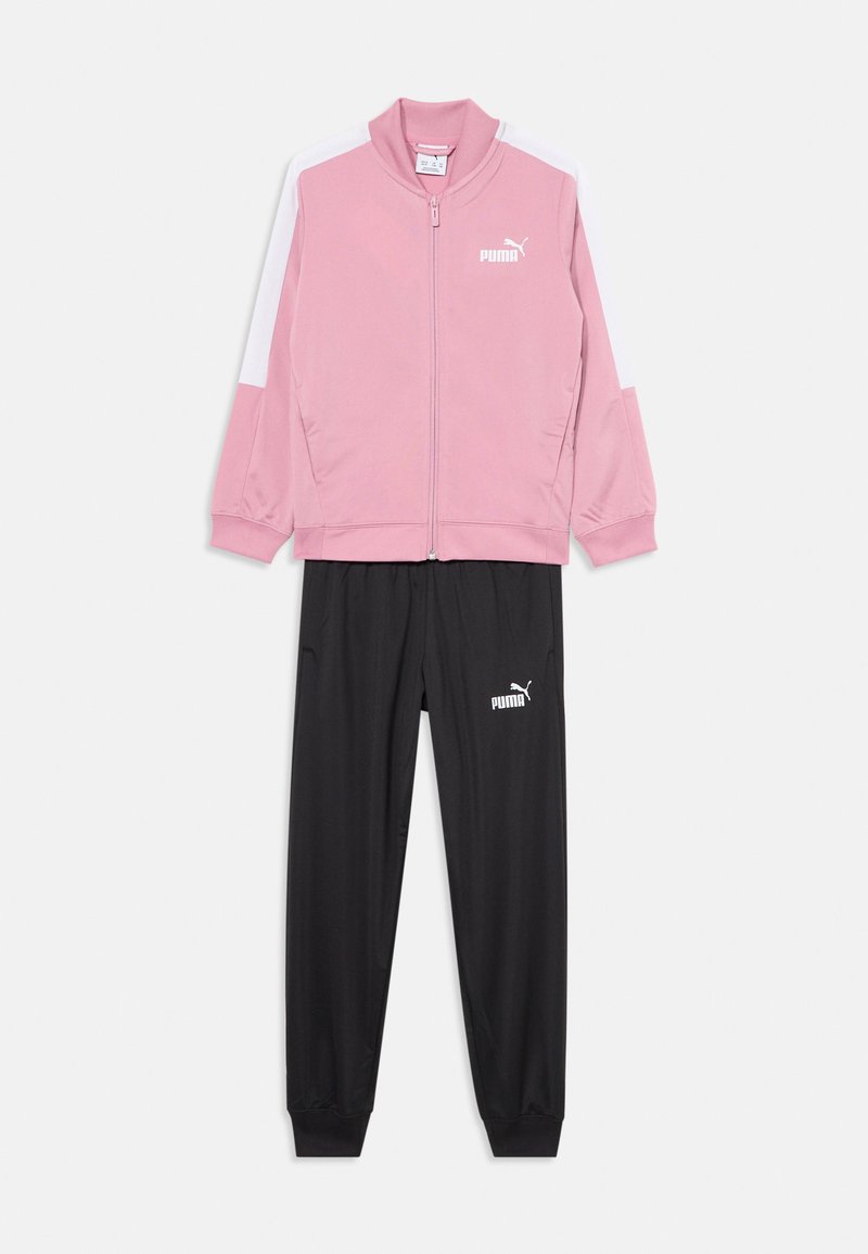 Rozā sporta jaka ar baltām akcentiem un rāvējslēdzēja priekšpusi, saskaņota ar melnām biksēm ar elastīgu jostu un logotipu. Materiāls: sintētiskais audums.