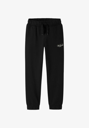 Pantalon de survêtement noir avec taille et poignets élastiques, cordon de serrage et petit texte blanc "Weekends" sur le haut de la cuisse gauche.