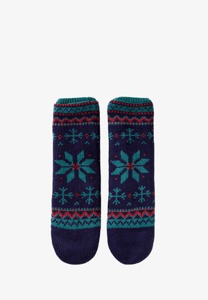 Granatowe dzianinowe skarpetki z zielono-czerwonym wzorem płatka śniegu, wyposażone w teksturowaną ramkę i prążkowany mankiet zapewniający pewne dopasowanie.
