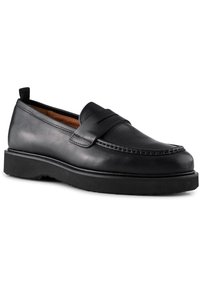 Svarta läderloafers med en slät yta och sydda detaljer. Har en platt gummisula och en slip-on design för enkel påtagning.