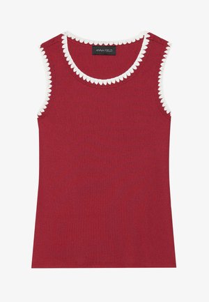 Débardeur rouge à côtes avec un ourlet festonné blanc autour de l'encolure et des emmanchures. Il présente une coupe ajustée et est fabriqué à partir d'un tissu doux.