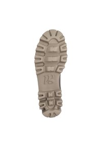 Semelle en caoutchouc avec un motif de grip texturé, de couleur beige et arborant un logo discret "pg" sur la zone du talon. Durable et conçu pour l'adhérence.