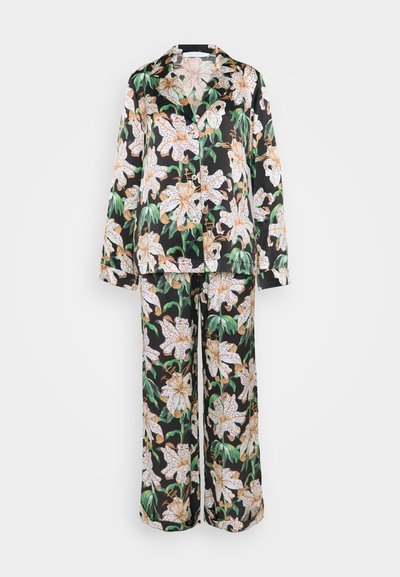 Black floral pajama set made of fabric with a satin finish, featuring large white lilies and green leaves, with a button-up shirt and wide-leg pants.