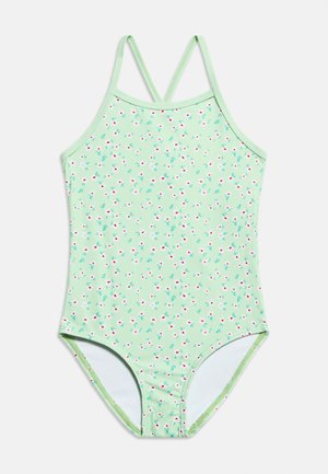 Lichtgroene eendelige badpak met klein wit en rood bloemmotief en dunne gekruiste schouderbandjes.