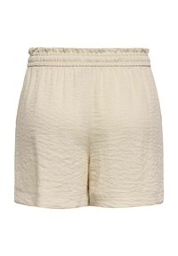 Short en tissu beige texturé avec taille élastique et coupe ample et décontractée.