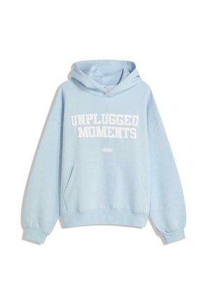 Light blue hoodie made of soft fabric featuring a front kangaroo pocket, drawstring hood, and bold white "UNPLUGGED MOMENTS" text.