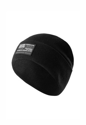 Black knit beanie with a fold-over cuff featuring a rectangular label. The label includes coordinates and brand details in white text.