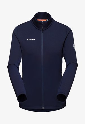 Dunkelblaue Fleece-Jacke mit hohem Kragen, durchgehendem Reißverschluss und Daumenlöchern. Mit Mammut-Logo auf der Brust und dem Ärmel. Glatte Textur.