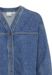 Jeansskjorta, ljusblå, V-ringning, långa ärmar, knappförslutning med mörka knappar, synlig sömnad och texturerad tyg.