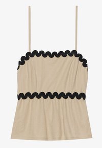 Beige kamisol med tynne stropper, med svart bølgekant langs toppen og midjen, laget av myk, lett stoff.
