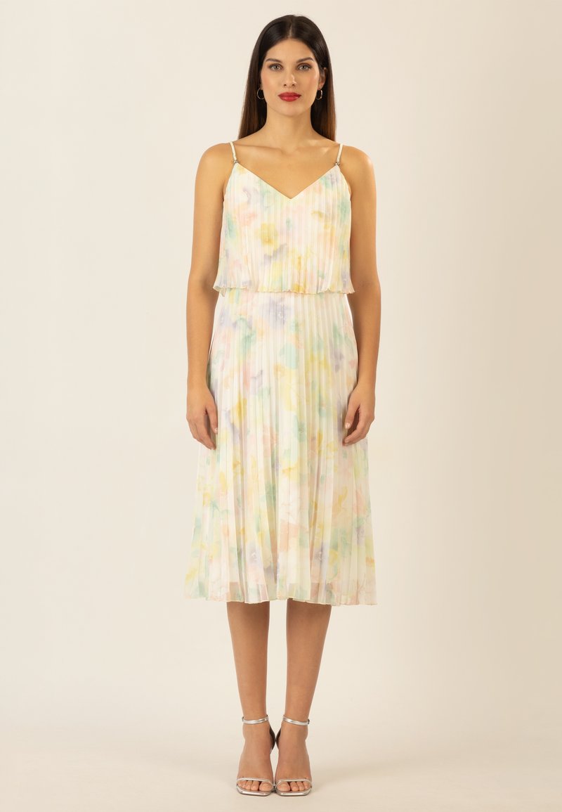 Vestido midi plisado con escote en V en colores pastel, con un cuerpo superpuesto y tirantes finos. Tela texturizada y fluida.