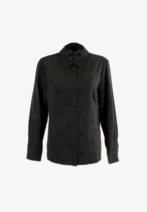 Blusa nera a maniche lunghe in tessuto morbido con una chiusura frontale a bottoni, caratterizzata da un motivo floreale composto da piccoli accenti lucidi.