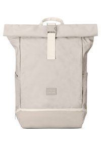 Beige roll-top backpack made of smooth, durable fabric with a front pocket, adjustable straps, and a branded logo patch.