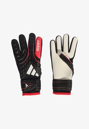 Para czarno-białych rękawic bramkarskich Adidas z czerwonymi akcentami, wyściełanymi dłońmi i regulowanymi paskami nadgarstka.