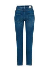 Jeans de denim en azul oscuro, con un corte slim, dos bolsillos traseros con bordes en ángulo y una etiqueta cosida en la cinturilla.