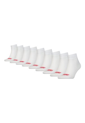 Vita ankelsockor, blandning av bomull, ribbade muddar, slät textur. Varje strumpa har en röd logotyp på sidan. Förpackning med tio.