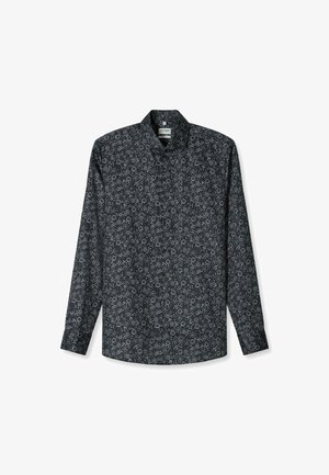 Langärmliges Hemd aus schwarzem Stoff mit einem sich wiederholenden weißen Blumenmuster und einem klassischen Kragen, mit Knopfverschlüssen auf der Vorderseite.