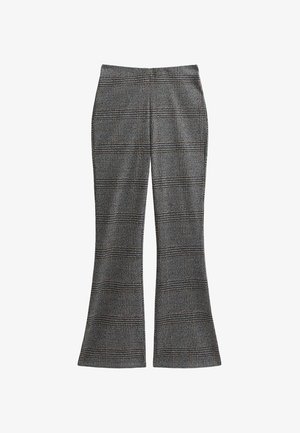 Pantalon taille haute évasé avec un motif plaid noir, blanc et marron, coupe ajustée, sans poches ni fermetures visibles.