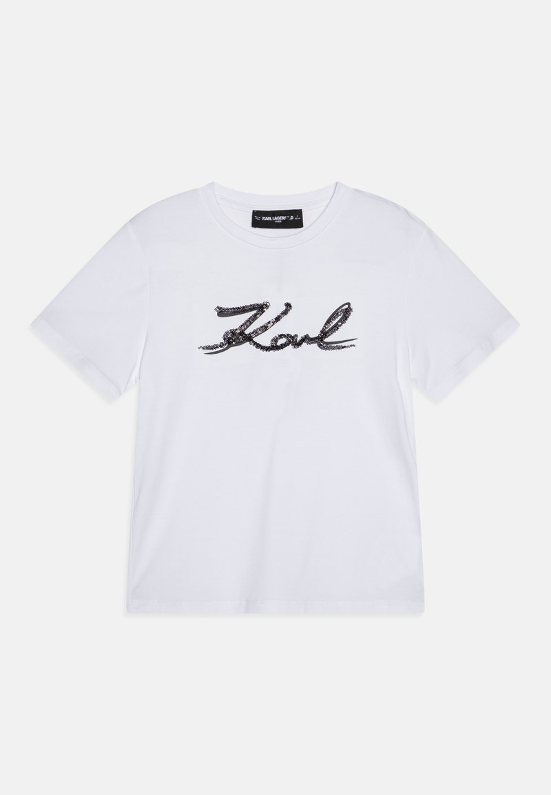 Camiseta de algodón blanca de manga corta, con un logo de lentejuelas negras en forma de escritura "Karl" en el frente y un cuello redondo.