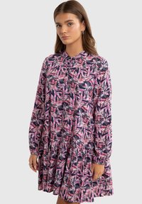 Floral dress featuring a dark blue base with pink leaf patterns, collar, long sleeves, and a tiered skirt. Made of lightweight fabric.