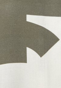 Cotton fabric featuring a large abstract shape in olive green on a white background, with a textured surface and clean lines.