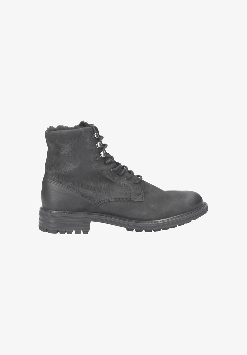 Schwarze Leder-Stiefeletten mit runder Zehenpartie, Schnürdesign und Metallösen. Robuste Gummisohle und weiche Fellpolsterung an der Oberkante.